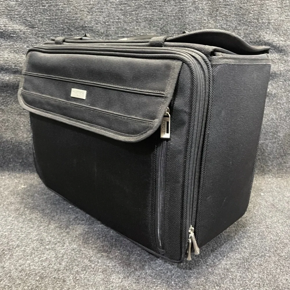 US Luggage New York Black Ballistic Nylon Rolling Catalog Case Wheeled Briefcase